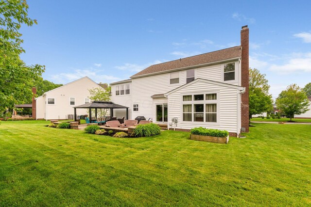 5073 Thornwood Dr, Westerville, OH 43082 - back of house featuring a gazebo, an outdoor hangout area, a chimney, and a yard
