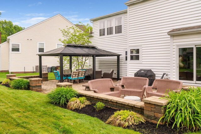 5073 Thornwood Dr, Westerville, OH 43082 - rear view of house featuring an outdoor hangout area, a gazebo, a patio area, and a lawn