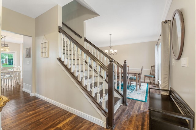 5073 Thornwood Dr, Westerville, OH 43082 - stairs featuring a chandelier, wood finished floors, and baseboards