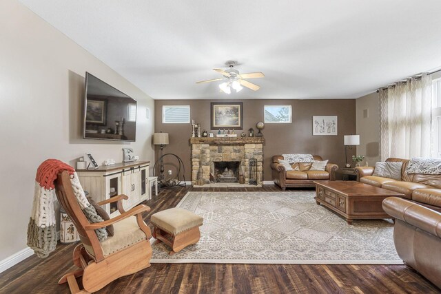 5073 Thornwood Dr, Westerville, OH 43082 - living area with wood finished floors, a ceiling fan, baseboards, and a stone fireplace