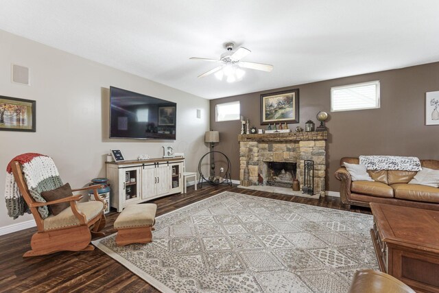 5073 Thornwood Dr, Westerville, OH 43082 - living area with wood finished floors, a ceiling fan, baseboards, and a stone fireplace