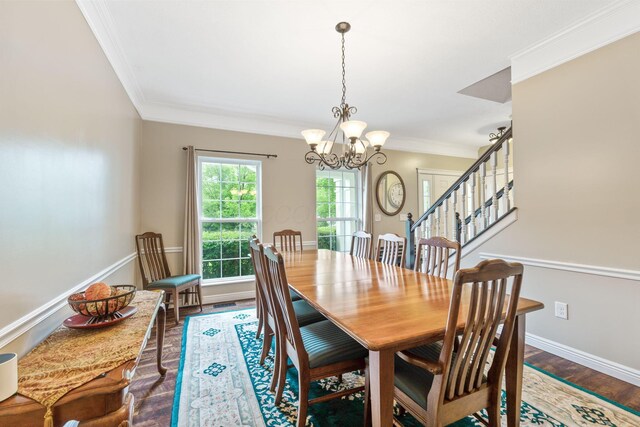 5073 Thornwood Dr, Westerville, OH 43082 - dining area with a chandelier, dark wood-type flooring, crown molding, baseboards, and stairway
