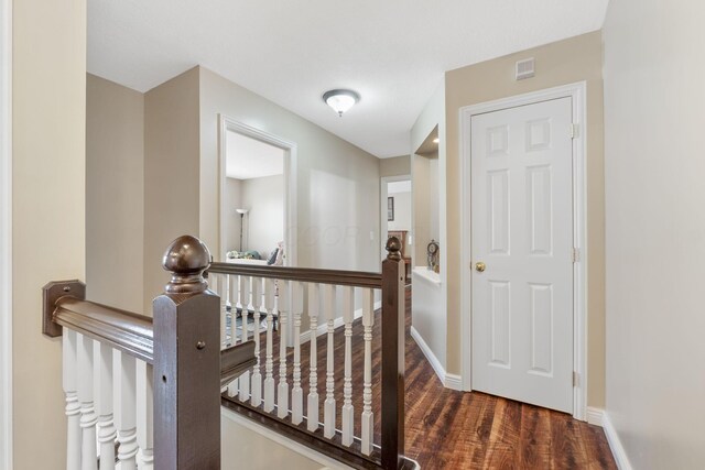 5073 Thornwood Dr, Westerville, OH 43082 - corridor with an upstairs landing, wood finished floors, and baseboards