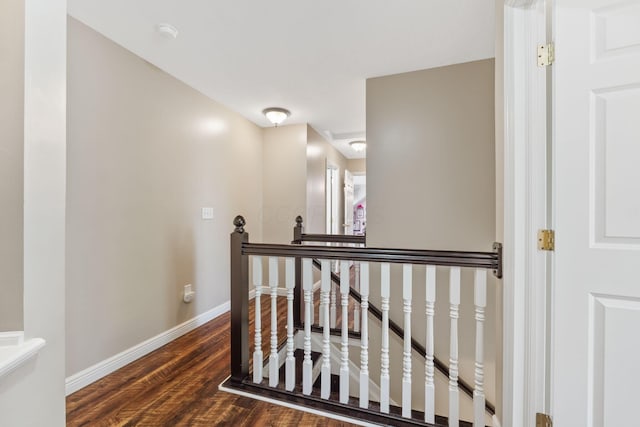 5073 Thornwood Dr, Westerville, OH 43082 - corridor featuring an upstairs landing, dark wood-style flooring, and baseboards