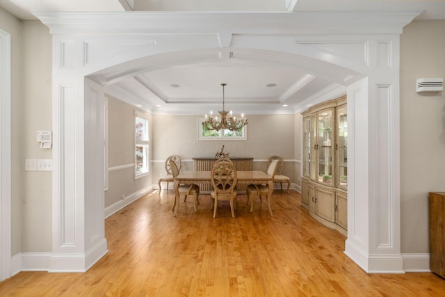 504 W Orange Rd, Delaware, OH 43015 - dining area with arched walkways, light wood-type flooring, a chandelier, and ornamental molding