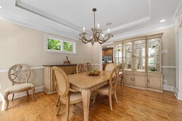 504 W Orange Rd, Delaware, OH 43015 - dining area featuring a chandelier, a raised ceiling, ornamental molding, light wood finished floors, and baseboards