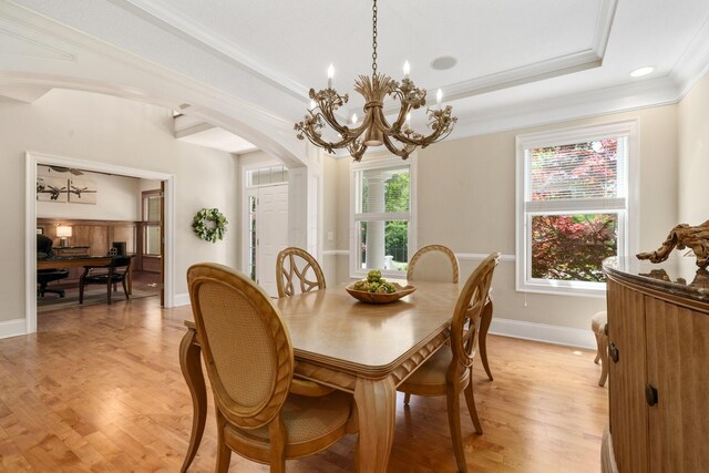 504 W Orange Rd, Delaware, OH 43015 - dining room featuring crown molding, a chandelier, arched walkways, light wood finished floors, and baseboards