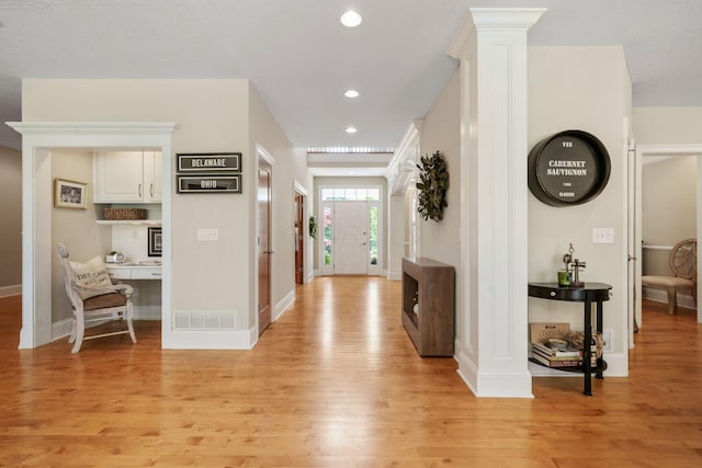 504 W Orange Rd, Delaware, OH 43015 - hall with light wood-style floors, baseboards, recessed lighting, and decorative columns