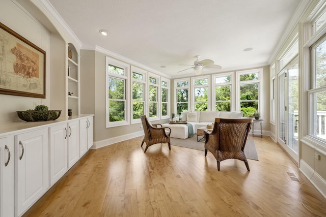 504 W Orange Rd, Delaware, OH 43015 - sunroom / solarium featuring french doors, baseboards, crown molding, and wood finished floors