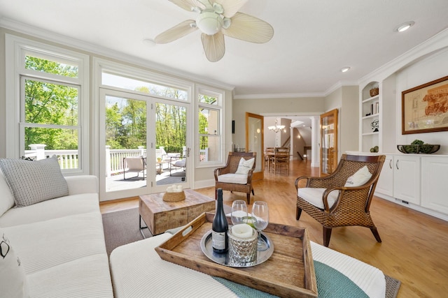 504 W Orange Rd, Delaware, OH 43015 - living area with a chandelier, light wood finished floors, built in features, ceiling fan, and crown molding