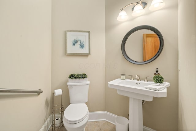 504 W Orange Rd, Delaware, OH 43015 - bathroom with baseboards, toilet, and tile patterned flooring