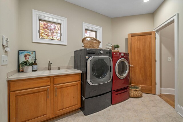 504 W Orange Rd, Delaware, OH 43015 - washroom featuring independent washer and dryer, healthy amount of natural light, cabinet space, and baseboards