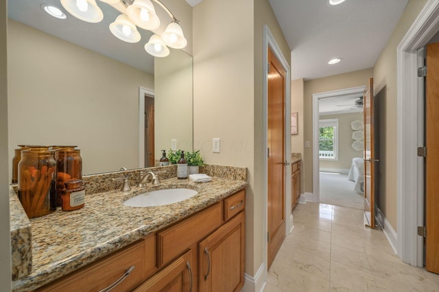 504 W Orange Rd, Delaware, OH 43015 - bathroom with baseboards, vanity, marble look tiles, a chandelier, and recessed lighting