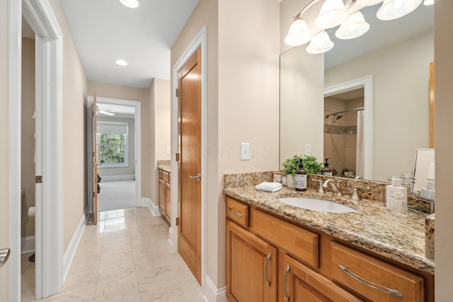 504 W Orange Rd, Delaware, OH 43015 - full bath with baseboards, vanity, tiled shower, marble look tiles, and recessed lighting