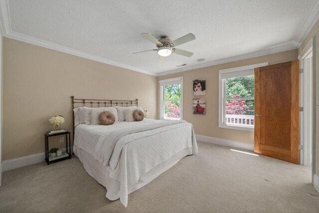 504 W Orange Rd, Delaware, OH 43015 - bedroom with ornamental molding, light carpet, baseboards, and a ceiling fan