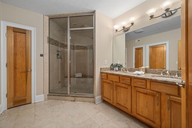 504 W Orange Rd, Delaware, OH 43015 - full bathroom featuring a shower stall, baseboards, double vanity, and marble finish flooring