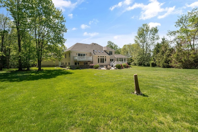 504 W Orange Rd, Delaware, OH 43015 - rear view of house with stucco siding and a lawn