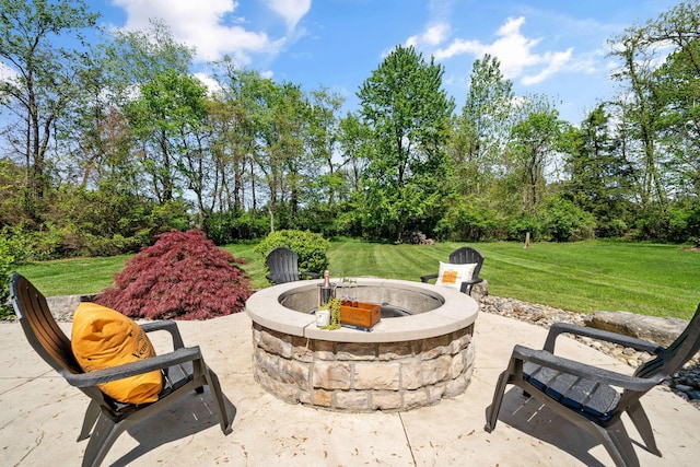 504 W Orange Rd, Delaware, OH 43015 - view of patio / terrace featuring a fire pit and view of wooded area