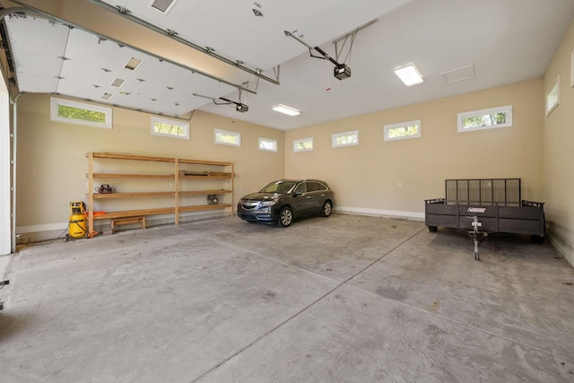 504 W Orange Rd, Delaware, OH 43015 - garage with a garage door opener and baseboards
