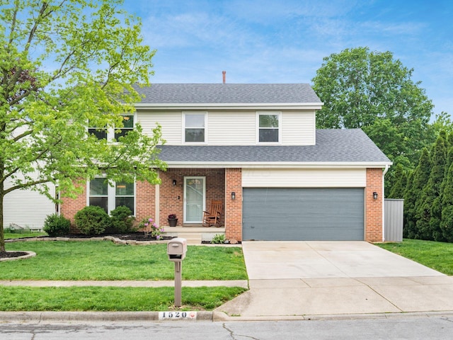 1520 Dickson Dr, Columbus, OH 43228 - traditional-style house with a front lawn, brick siding, driveway, and roof with shingles