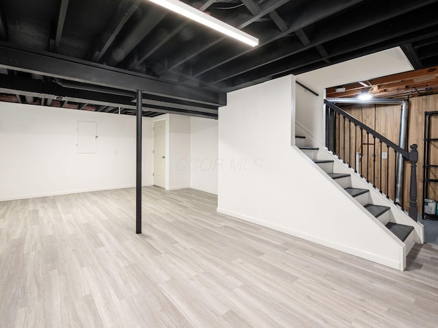 1520 Dickson Dr, Columbus, OH 43228 - finished basement featuring wood finished floors, stairway, and baseboards