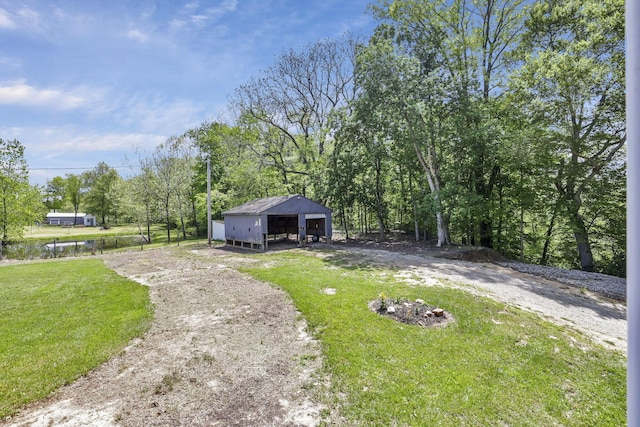 7205 W Grubb Rd NE, Thornville, OH 43076 - view of front of house with an outbuilding and a front yard