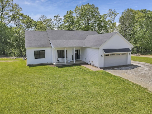 7205 W Grubb Rd NE, Thornville, OH 43076 - view of front of house featuring dirt driveway, a front yard, an attached garage, a porch, and a shingled roof