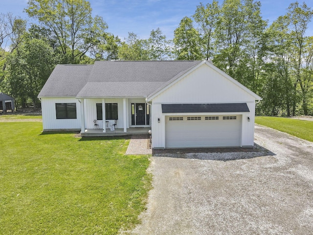 7205 W Grubb Rd NE, Thornville, OH 43076 - view of front facade featuring dirt driveway, covered porch, a front lawn, an attached garage, and a shingled roof