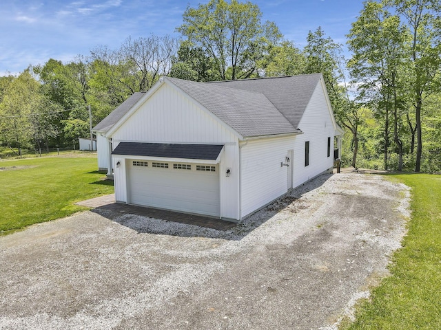 7205 W Grubb Rd NE, Thornville, OH 43076 - view of home's exterior with a shingled roof, a lawn, and view of scattered trees