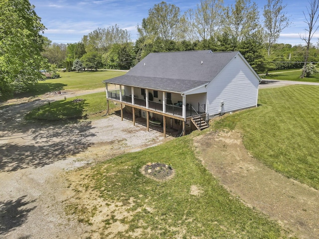 7205 W Grubb Rd NE, Thornville, OH 43076 - back of property featuring a yard, a wooden deck, roof with shingles, and view of wooded area