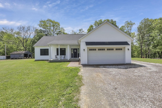 7205 W Grubb Rd NE, Thornville, OH 43076 - view of front of property featuring dirt driveway, covered porch, an attached garage, a front lawn, and a shingled roof