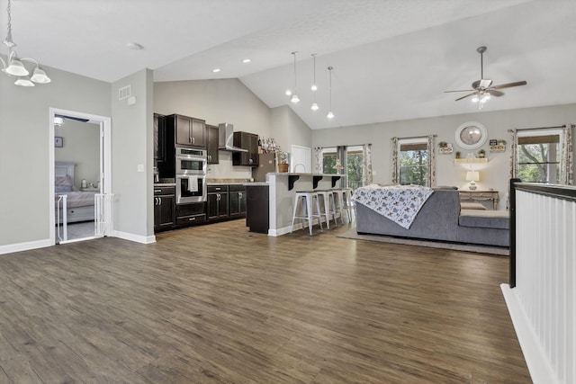 7205 W Grubb Rd NE, Thornville, OH 43076 - kitchen with open floor plan, appliances with stainless steel finishes, a kitchen bar, a chandelier, and dark wood finished floors