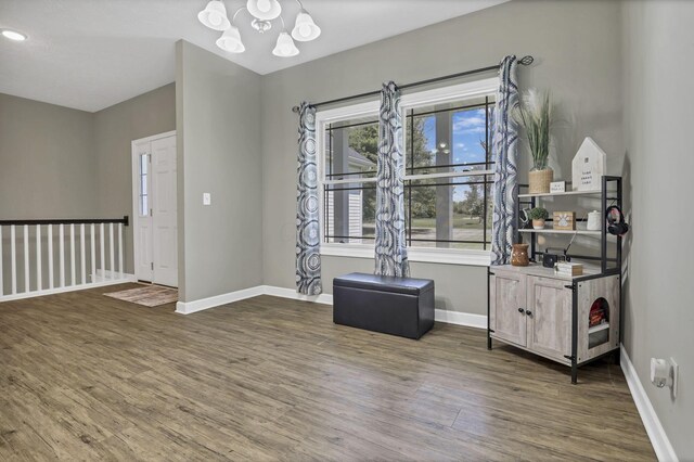 7205 W Grubb Rd NE, Thornville, OH 43076 - interior space with wood finished floors, a chandelier, and baseboards