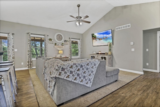 7205 W Grubb Rd NE, Thornville, OH 43076 - living room with ceiling fan, wood finished floors, baseboards, and high vaulted ceiling