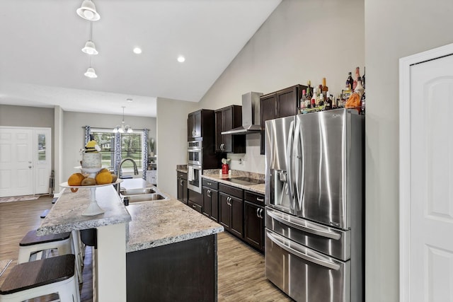 7205 W Grubb Rd NE, Thornville, OH 43076 - kitchen with appliances with stainless steel finishes, a sink, wall chimney exhaust hood, light wood-style flooring, and high vaulted ceiling