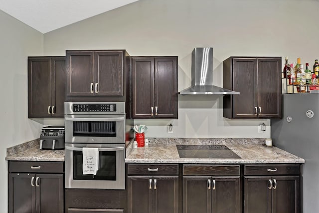 7205 W Grubb Rd NE, Thornville, OH 43076 - kitchen with wall chimney range hood, black electric stovetop, double oven, lofted ceiling, and dark brown cabinetry
