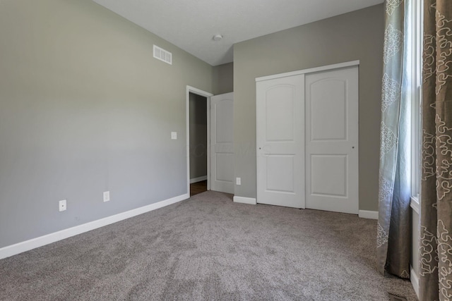 7205 W Grubb Rd NE, Thornville, OH 43076 - unfurnished bedroom featuring carpet flooring, a closet, and baseboards