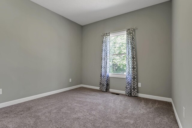 7205 W Grubb Rd NE, Thornville, OH 43076 - carpeted spare room featuring baseboards