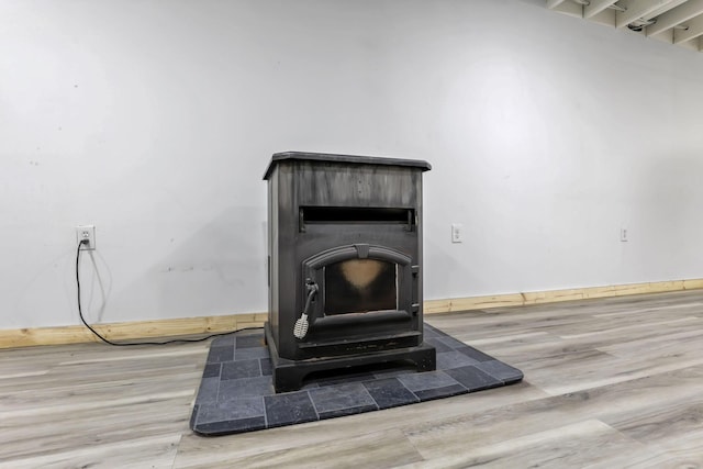7205 W Grubb Rd NE, Thornville, OH 43076 - detailed view of a wood stove and wood finished floors