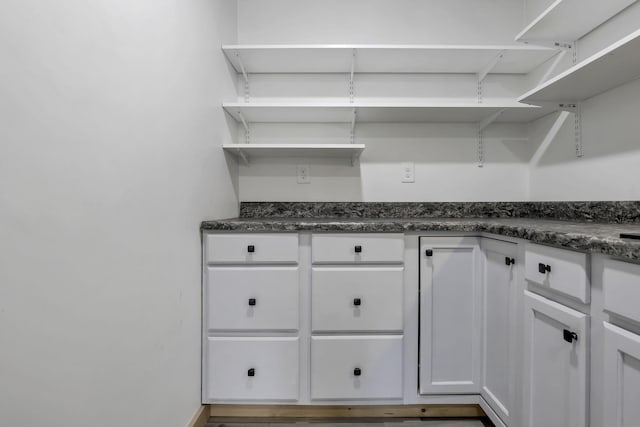 7205 W Grubb Rd NE, Thornville, OH 43076 - kitchen with open shelves, dark countertops, and white cabinets