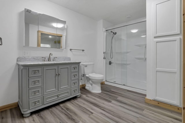 7205 W Grubb Rd NE, Thornville, OH 43076 - full bathroom with toilet, a stall shower, and wood finished floors