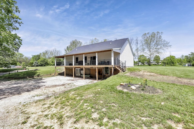 7205 W Grubb Rd NE, Thornville, OH 43076 - back of house featuring stairs, a deck, a lawn, and driveway