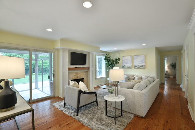 1155 Millcreek Ct, Columbus, OH 43220 - living room with healthy amount of natural light, a fireplace, hardwood / wood-style floors, recessed lighting, and baseboards