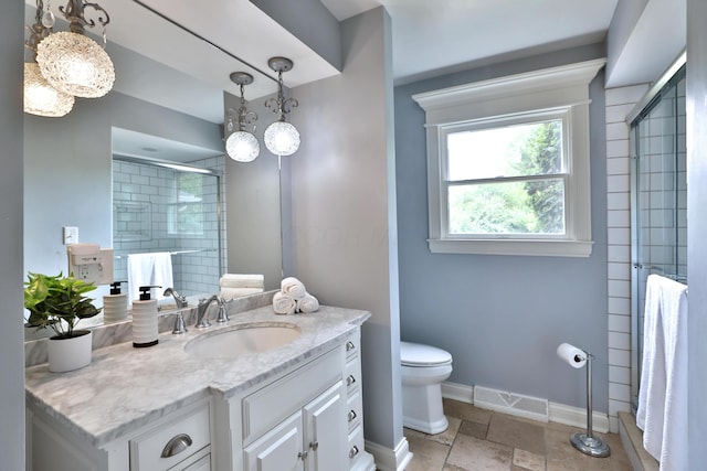 1155 Millcreek Ct, Columbus, OH 43220 - full bath with vanity, toilet, baseboards, a tile shower, and stone tile flooring