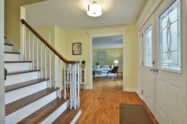 1155 Millcreek Ct, Columbus, OH 43220 - foyer entrance featuring stairs, light wood-style floors, and baseboards