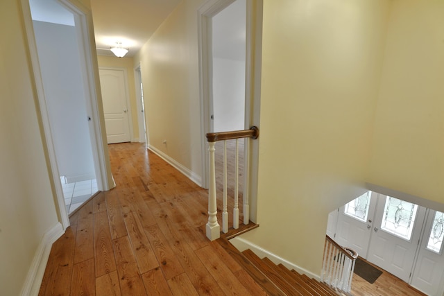 1155 Millcreek Ct, Columbus, OH 43220 - corridor with wood-type flooring, an upstairs landing, and baseboards