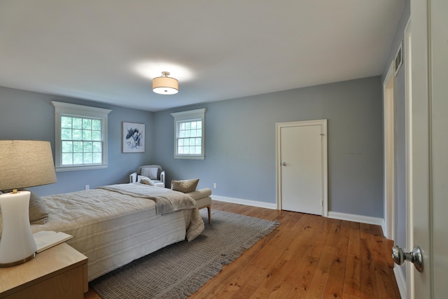 1155 Millcreek Ct, Columbus, OH 43220 - bedroom with hardwood / wood-style flooring and baseboards