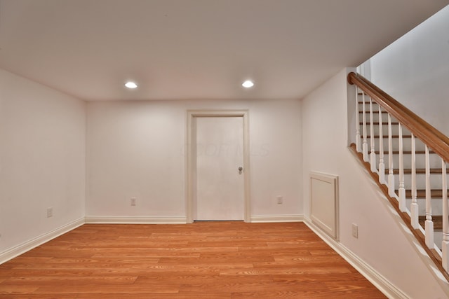 1155 Millcreek Ct, Columbus, OH 43220 - below grade area featuring light wood finished floors, recessed lighting, baseboards, and stairway