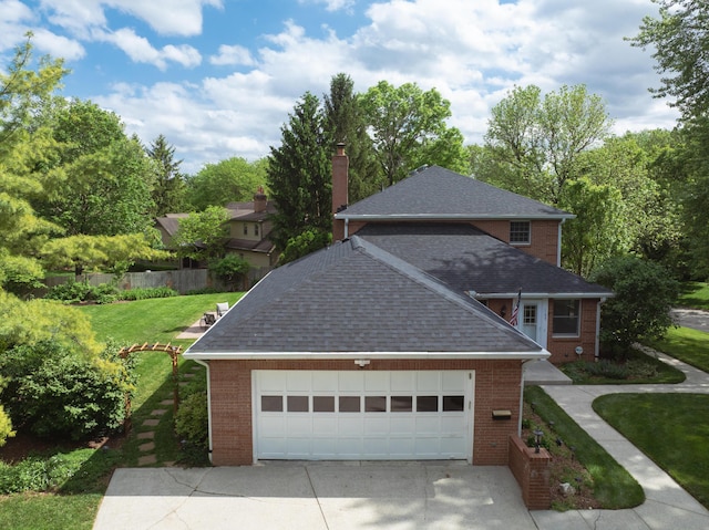 1155 Millcreek Ct, Columbus, OH 43220 - view of front facade with roof with shingles, brick siding, driveway, and an attached garage