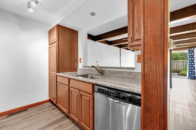 144 W Ticonderoga Dr Unit H, Westerville, OH 43081 - kitchen featuring dishwasher, a sink, light wood-style floors, baseboards, and brown cabinetry